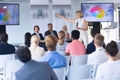 Female speaker giving presentation in a business seminar Royalty Free Stock Photo