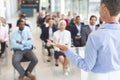 Female speaker speaks in a business seminar