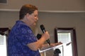 Female speaker speaks at a graduation ceremony