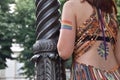 A female spectator with the gay rainbow flag painted on her arm at the Gay Pride Parade 2018 in Italy