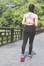 Female sport fitness runner jogging outdoors on bridge in spring Royalty Free Stock Photo