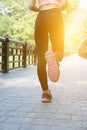 Female sport fitness runner jogging outdoors on bridge in spring Royalty Free Stock Photo