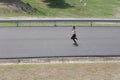 Female sport fitness runner jogging outdoors in spring or summer Royalty Free Stock Photo