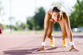 Female sprinter getting ready for the run Royalty Free Stock Photo