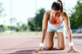Female sprinter getting ready for the run Royalty Free Stock Photo