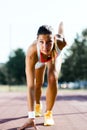 Female sprinter getting ready for the run Royalty Free Stock Photo