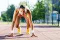 Female sprinter getting ready for the run Royalty Free Stock Photo