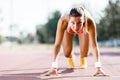 Female sprinter getting ready for the run Royalty Free Stock Photo