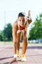 Female sprinter getting ready for the run Royalty Free Stock Photo