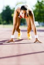 Female sprinter getting ready for the run Royalty Free Stock Photo