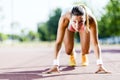 Female sprinter getting ready for the run