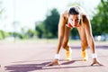 Female sprinter getting ready for the run Royalty Free Stock Photo