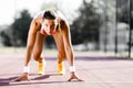 Female sprinter getting ready for the run Royalty Free Stock Photo
