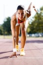 Female sprinter getting ready for the run Royalty Free Stock Photo