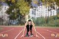 Female Sprinter Getting Ready to Start The Race