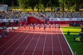 Female Sprinters Navigate 100m Race with Grace in Enchanting Twilight Setting at Track and Royalty Free Stock Photo