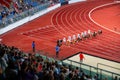 Female Sprinters at the start line of the 100 meters sprint race. Track and Field photo for Summer Game in Paris Royalty Free Stock Photo