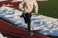 Female Sprinting on a track in the snow Royalty Free Stock Photo