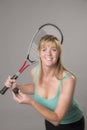 Female squash player with raquet and ball