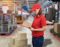 Female staff Delivering products Sign the signature on the product receipt form with parcel boxes Royalty Free Stock Photo