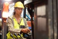 Female staff driving forklift in warehouse Royalty Free Stock Photo