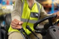 Female staff driving forklift in warehouse Royalty Free Stock Photo