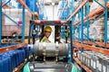 Female staff driving forklift in warehouse Royalty Free Stock Photo