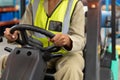 Female staff driving forklift in warehouse Royalty Free Stock Photo