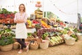 Female Stall Holder At Farmers Fresh Food Market Royalty Free Stock Photo