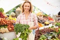 Female Stall Holder At Farmers Fresh Food Market Royalty Free Stock Photo