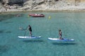Female stand up paddlers clear turquoise water Mallorca