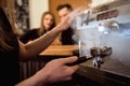 Female starting her day on a new job as a barista. Working in a cafe.