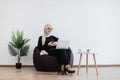 Female starting online meeting via computer in workplace