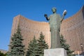 Female statue with white dove against Cosmos Hotel in Moscow