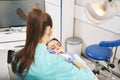 Dentist scanning woman teeth with intraoral 3D scanner