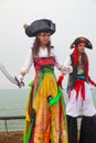 Female stiltwalker in bright Purim pirate costume