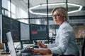 Female stockbroker in formal clothes works in the office with financial market Royalty Free Stock Photo