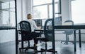 Female stockbroker in formal clothes works in the office with financial market Royalty Free Stock Photo