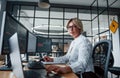 Female stockbroker in formal clothes works in the office with financial market Royalty Free Stock Photo