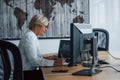 Female stockbroker in formal clothes works in the office with financial market Royalty Free Stock Photo