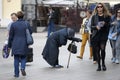 Female street begger in busy street of Moscow near metro Arbatskaya Royalty Free Stock Photo