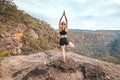 Female strength fitness yoga balance asana mountain ledge