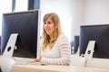 Female student/ businesswoman using a desktop computer