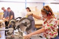 Female Student In Carpentry Class Using Circular Saw Royalty Free Stock Photo