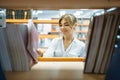 Female student choosing book in library Royalty Free Stock Photo