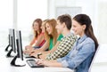 Female student with classmates in computer class Royalty Free Stock Photo