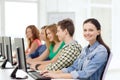 Female student with classmates in computer class Royalty Free Stock Photo