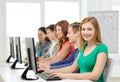 Female student with classmates in computer class Royalty Free Stock Photo