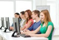 Female student with classmates in computer class Royalty Free Stock Photo