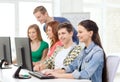 Female student with classmates in computer class Royalty Free Stock Photo